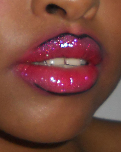 Closeup of a sparkly pink glossy fantasy lip combo.