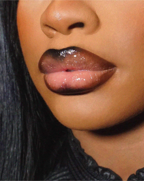 Closeup of JT with a black and nudetinted glossy fantasy lip combo.